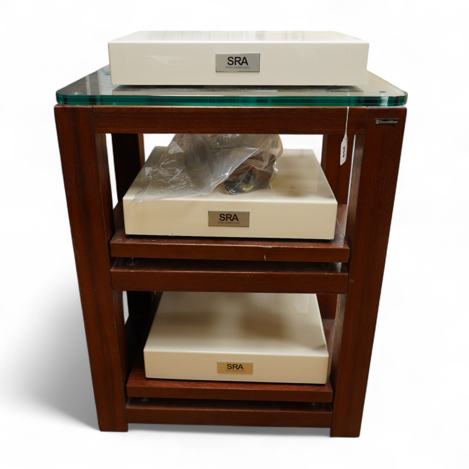 A three section Soundbox HiFi stereo stand in teak, 83cm high, 66cm wide, 46.5cm deep, together with three Silent Running Audio (SRA) Ohio Class high end audio base units in cream cases (designed to reduce vibration) - o